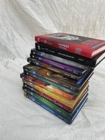 Stack of 14 books from The 39 Clues series, showing title and spine details.