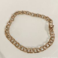 Top view of bracelet laid in a circle showing double link chain design