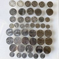 Image showing a collection of Canadian coins neatly arranged including 50 cent, dollar, nickel and dime denominations from 1960s to 1980s.