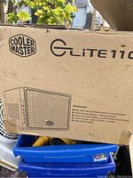 Cooler Master Elite 110 box front with Cooler Master and Elite 110 logos visible, showing the product features.
