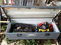 Open metal Jobox tool box interior with some bags and tools inside (contents not for sale).