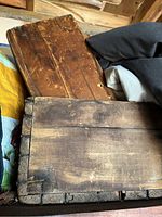 Two small wooden crates stacked showing aged wood and wear