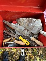 Opened red metal toolbox showing rusty gardening trowels, metal files with wooden and plastic handles, and other small hand tools.