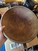 Top view of the round wooden bread bowl showing interior wear and patina.