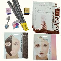 Spa Relaxus face masks, hand masks, Tree of Life aromatherapy necklace with extra pads and assorted incense sticks arranged for display.