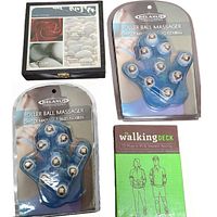 Lot contents showing two packaged Relaxus Roller Ball Hand Massagers, boxed 'The Walking Deck' exercise cards, and a used decorative Relaxus wooden box