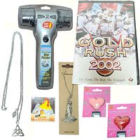Lot items visible including shoe polisher in plastic clamshell, hockey DVD, kitchen timer, two necklaces, and two Tunes for Two headphone splitters