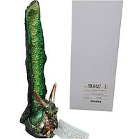 Green dragon tower stick incense burner with detailed dragon head and textured green and gold vertical body, seen next to original white gift box with label