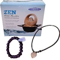 Relaxus Zen Water Fountain box with product image showing beige textured structure, spinning glass ball, and black base.