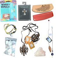 All lot items including pendulums, pins, worry dolls, bracelets, wooden plaques, Buddha figurine, and pens arranged for display.