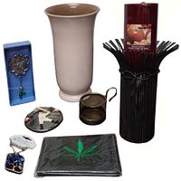 Complete view of all items in the lot showing vase, candle holder, wine bottle decoration, wallet, necklace box, teabag strainer, and ornament.