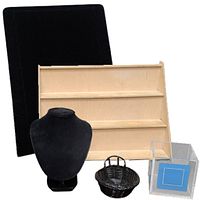 Set of jewelry and gemstone display items including velvet necklace bust, wooden shelf, basket, and acrylic box.