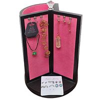 Black wood jewelry spinner approximately 13 inches tall with pink velvet interior, crystal knob, metal hooks, and assorted hanging jewelry.