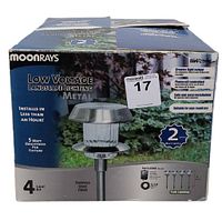 Box of Moonrays Low Voltage Landscape Lighting Kit showing 4 light kit, stainless steel finish, 5 watt brightness per fixture, metal lights, and claims of easy installation and year-round use.