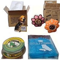 All items in lot displayed on table, including dog figurine, flower salt and pepper shakers, John Deere coasters in packaging, and Titanic ice cube tray still in box.