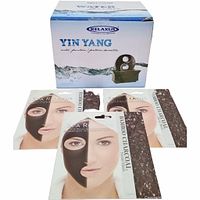 Photo of the boxed Relaxus Yin Yang water fountain and three bamboo charcoal facial masks in sealed packets in front of the box.