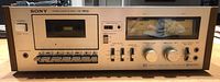 Front view of Sony TC-199SD cassette deck showing cassette slot, control buttons and VU meters.