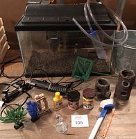 Full lot of 10 gallon aquarium with decorations, equipment and food