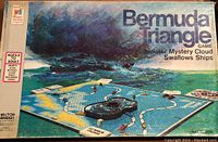 Photo of Bermuda Triangle game box and board showing layout with boats and spinning mechanism