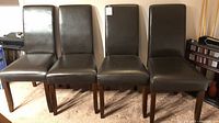 Front view of four chairs side by side
