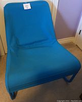 Front view of blue IKEA Locksta chair with removable fabric cover
