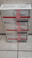 Stack of three sealed boxes each labeled Quorum Classic ceiling fan.