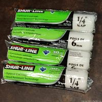 Photo showing four SHUR-LINE paint roller covers stacked, with packaging details and branding visible.