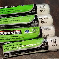 Photo showing Shur-Line paint rollers with 1/4 inch and 6 mm nap labels on packaging, highlighting product details and brand name.