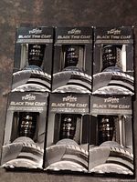 Six boxes of Turtle Wax Black Tire Coat displayed in two rows of three each, showcasing product packaging and branding.