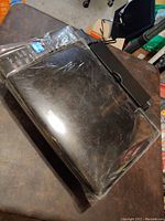 Top view of Epson Stylus NX420 showing model design and packaging wrapped in protective plastic film.