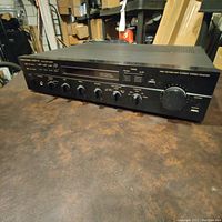 Front angle view of HK 550 Vxi receiver showing control knobs and panel labeling.