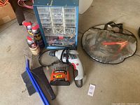 Full lot overview showing drill, bit set, fasteners organizer, jumper cables, spray cans, brush and scraper