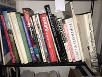 Books on a shelf showing various titles on art, animation, Hollywood, and classic paintings.