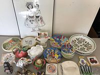 Overview of the whimsical dishes, teapots, pitcher, coasters, bowls, and platter showing a variety of playful patterns and colors.