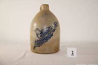 Front view of jug showing cobalt bird and branch motif