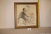 Full view of framed print showing the entire artwork and gilded frame with measuring tape showing scale.