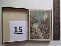 One wooden puzzle laid out in its box, showing a nursery rhyme themed illustration with animals and a fence, measuring approx. 4 inches by 5 inches.