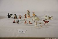 Full spread of the entire ceramic miniature animal collection showing all individual pieces grouped on a white background.