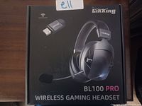 Front view of the Gikking BL100 Pro Wireless Gaming Headset retail box showing product image and USB connector graphic