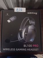 Front of retail box showing Gikking BL100 Pro wireless gaming headset and USB receiver.