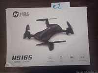 Photo of Holy Stone HS165 drone box with product image and key feature icons visible