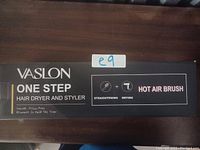 Image of the Vaslon One Step Hair Dryer and Styler box showing branding and product features such as straightening, drying, and hot air brush functionality.
