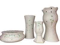 Overview of all four Belleek Irish Parian porcelain pieces: cachepot bowl, basketweave cylinder vase, hexagonal footed bud vase, and pierced vase