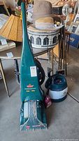 Front view of Bissell Power Steamer Pro upright cleaner showing model and dirt on unit