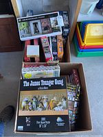 Boxed grouped puzzles including 'The James Younger Gang 1000-piece puzzle','panoramic 1000-piece puzzle and other assorted puzzles