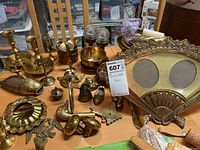 Overview of assorted vintage brass items on tabletop