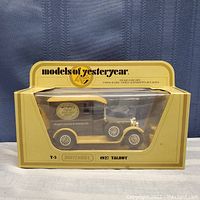 Front view of the 1927 Talbot model in its original box with minor creasing showing the details of the model truck and box branding.