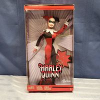 Photo of Barbie Harley Quinn doll in original packaging showing full doll and box front.