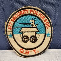 Front of embroidered Snoopy military patch with 377th Security Police Sqdn text
