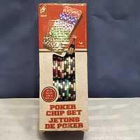 Photo showing the set of poker chips in original box labeled 'Poker Chip Set Jetons de Poker' containing 100 chips, with colors visible through window.